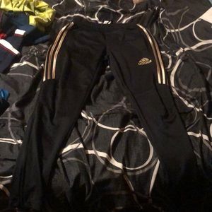 Size S adidas official black color and has gold stripes haven’t been used